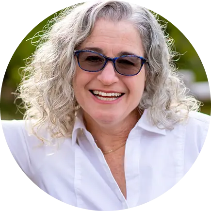 Lisa Cooperman smiling in close-up profile image.